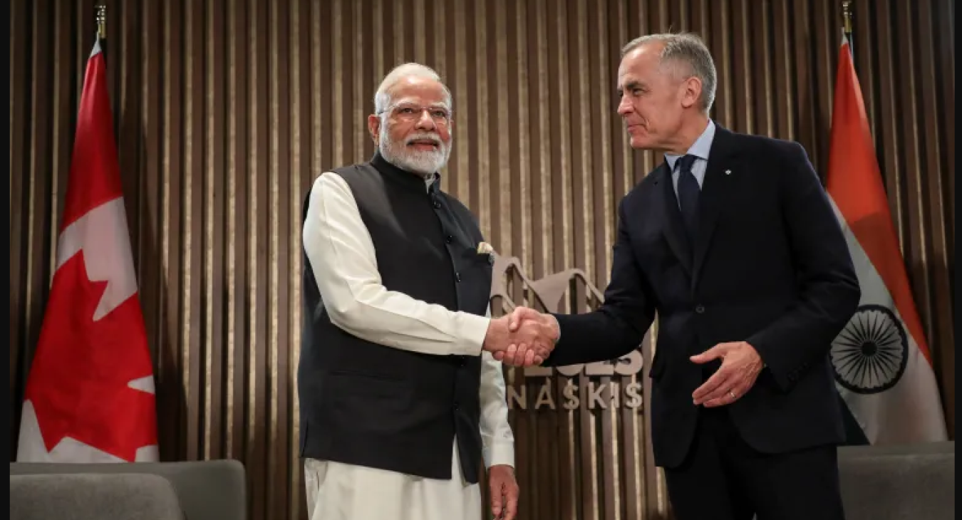 Narendra Modi shakes hands with Mark Carney